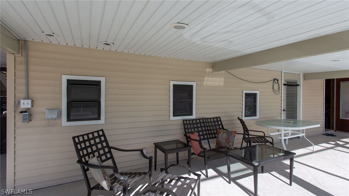 360 Bayland Road Fort Myers Beach, FL 33931 - Photo 25 of 35 a outdoor space with patio furniture