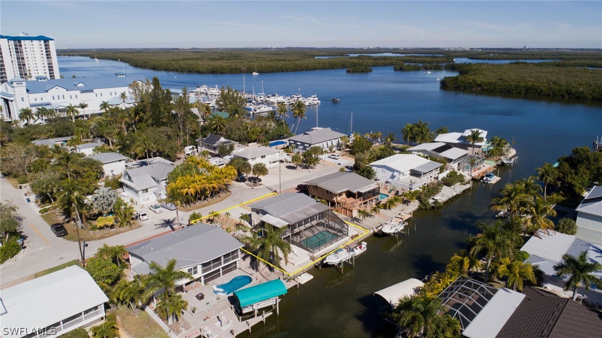 360 Bayland Road Fort Myers Beach, FL 33931 - Photo 31 of 35 an aerial view of a house with a lake view