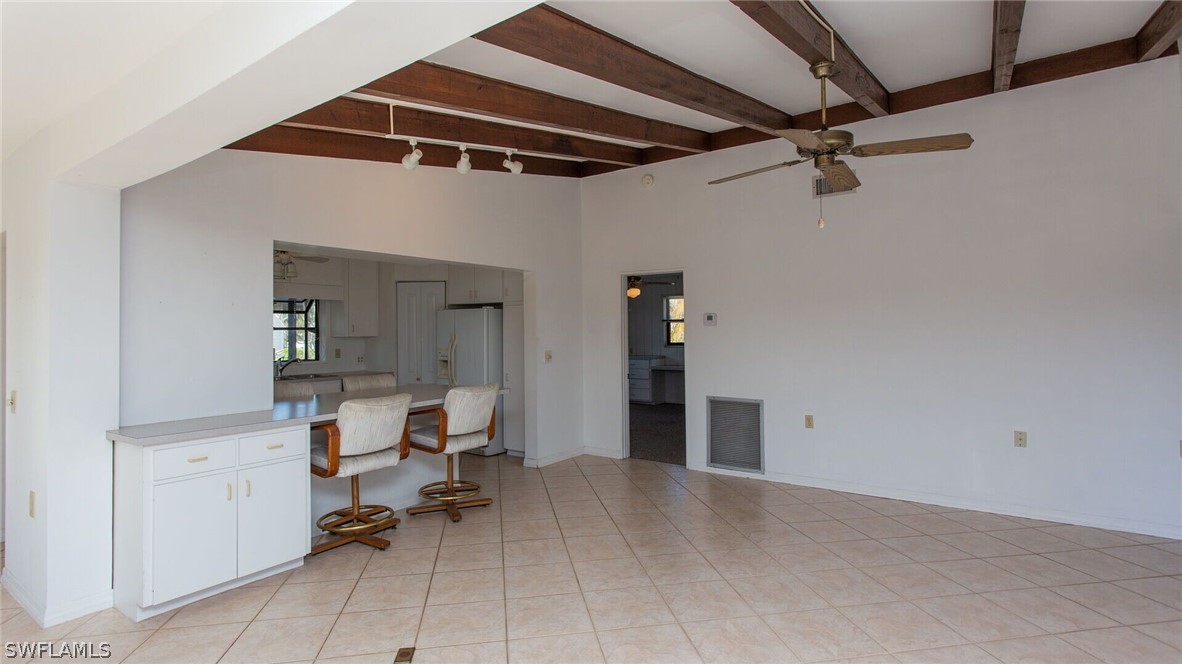 360 Bayland Road Fort Myers Beach, FL 33931 - Photo 7 of 35 a view of a livingroom with a furniture and a ceiling fan