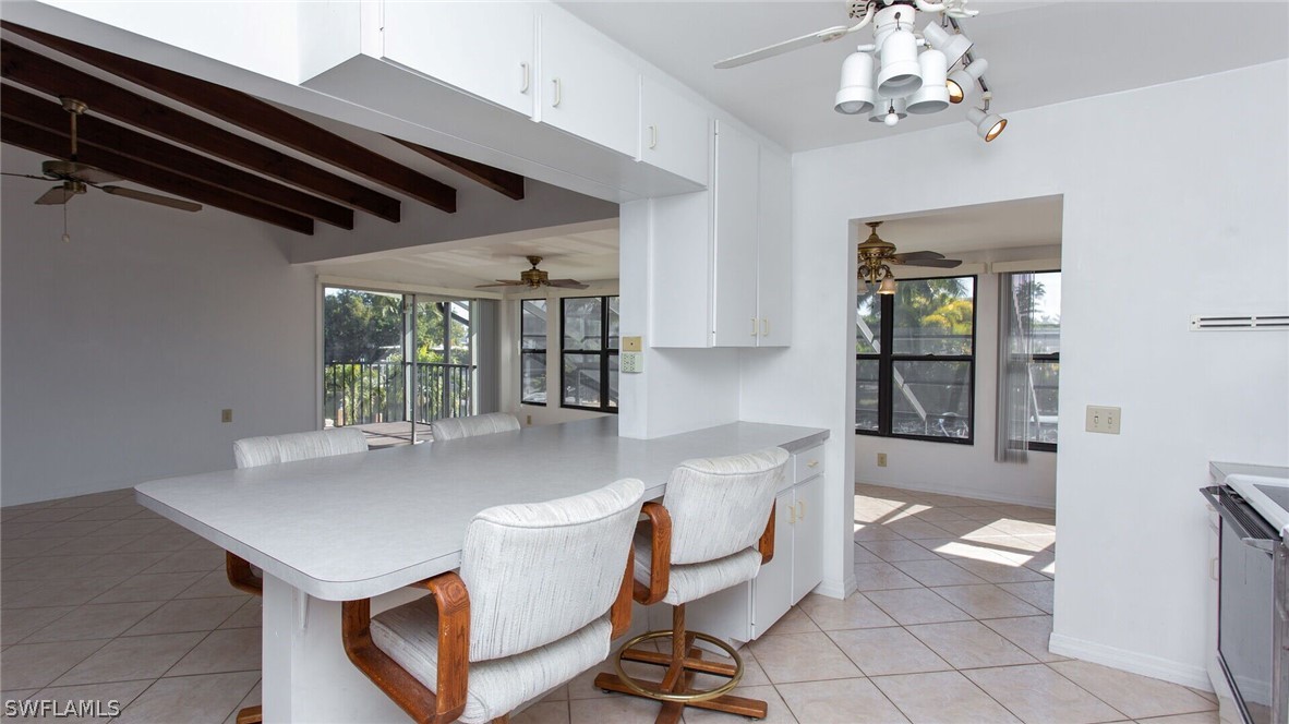 360 Bayland Road Fort Myers Beach, FL 33931 - Photo 10 of 35 a room with pool table and windows