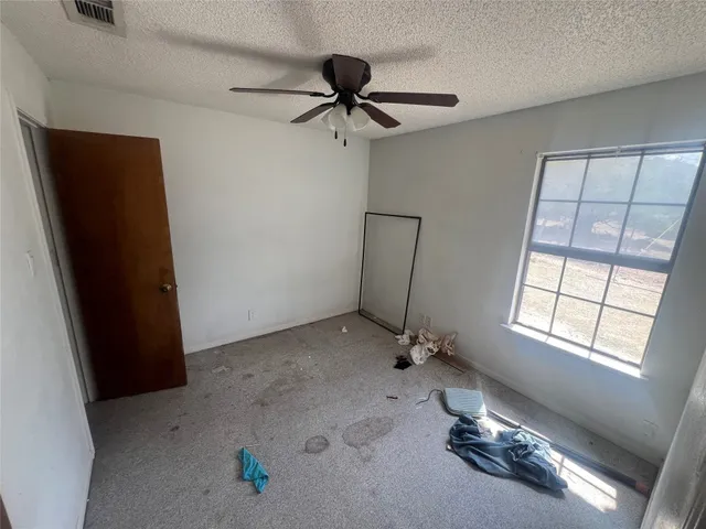 a view of empty room with windows