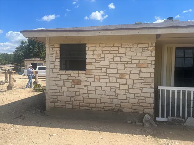 a bathroom with a sink a mirror and a shower