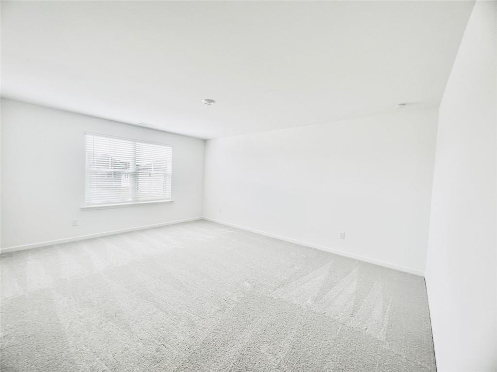 1529 Hay Patch Lane Loganville, GA 30052 - Photo 12 of 24 an empty room with a window