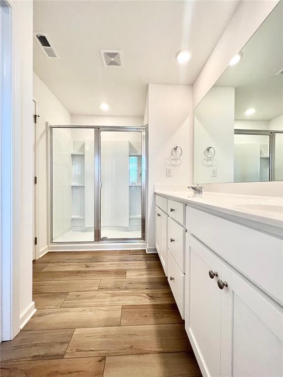 1529 Hay Patch Lane Loganville, GA 30052 - Photo 13 of 24 a spacious bathroom with a shower sink and mirror