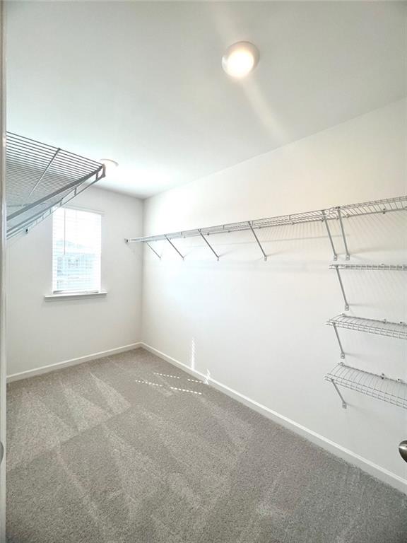 1529 Hay Patch Lane Loganville, GA 30052 - Photo 15 of 24 a view of a room with racks on the wall