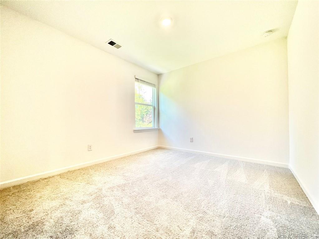 1529 Hay Patch Lane Loganville, GA 30052 - Photo 22 of 24 a view of empty room with wooden floor