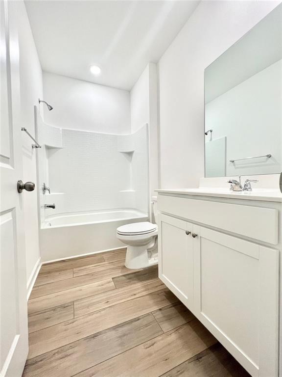 1529 Hay Patch Lane Loganville, GA 30052 - Photo 7 of 24 a bathroom with a sink a toilet and a large mirror