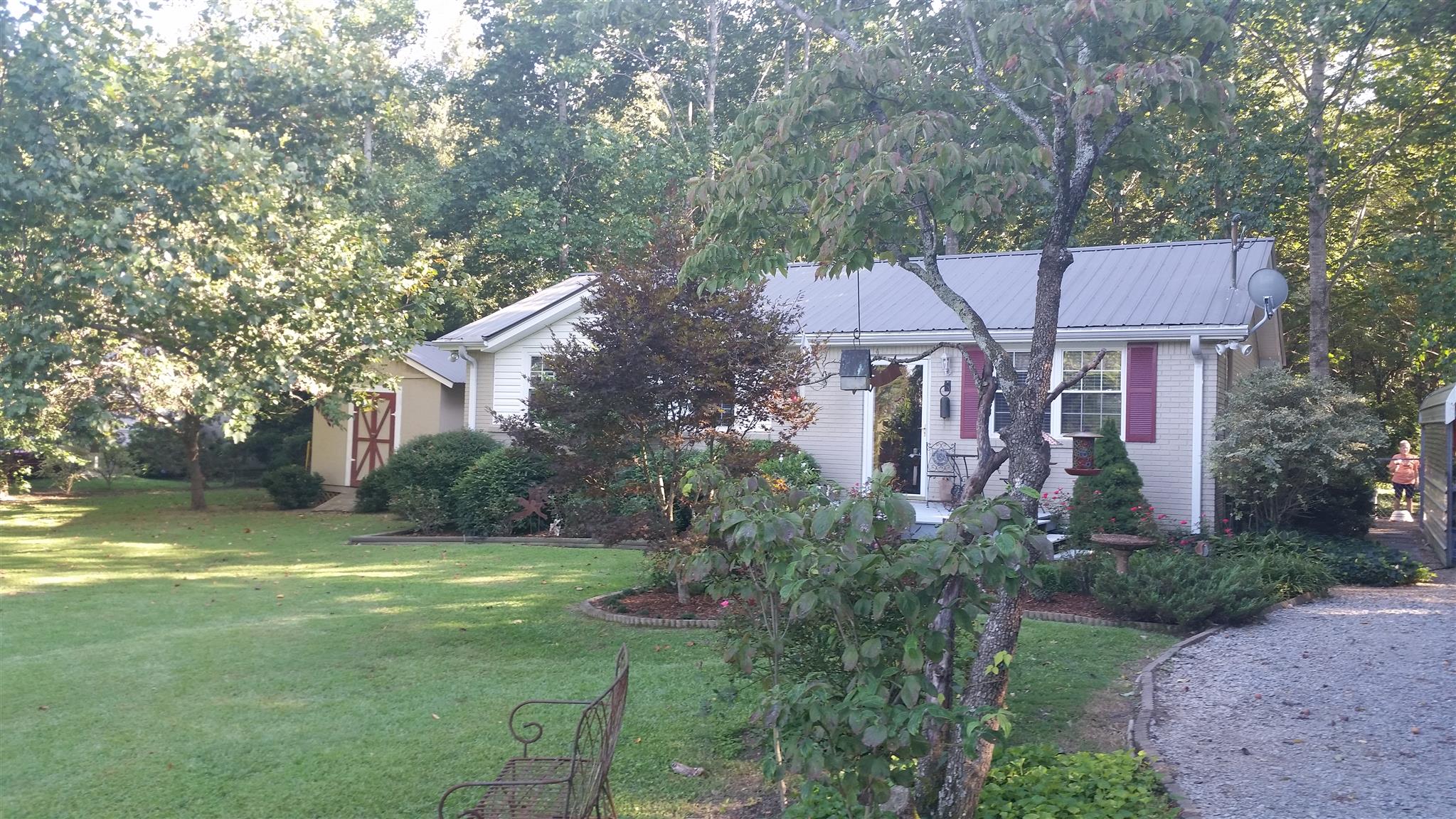 7816 Chester Road Fairview, TN 37062 - Photo 1 of 26 a front view of a house with garden