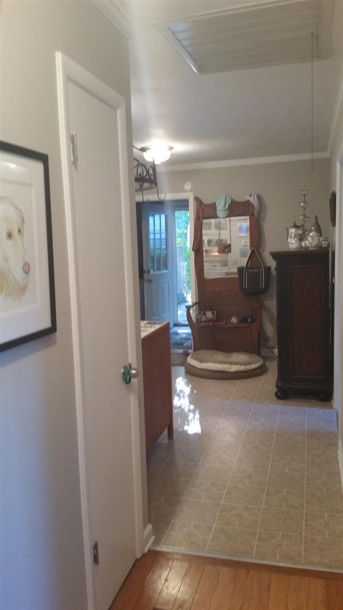7816 Chester Road Fairview, TN 37062 - Photo 12 of 26 a view of a hallway to a livingroom with furniture