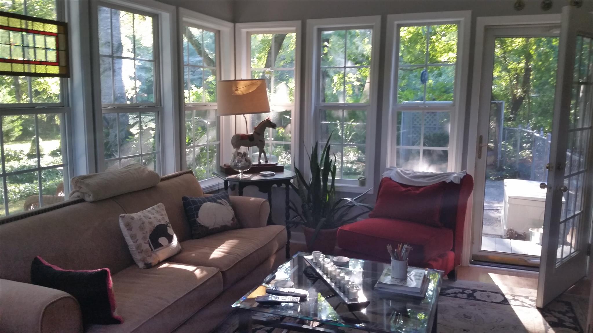 7816 Chester Road Fairview, TN 37062 - Photo 13 of 26 a living room with furniture and a floor to ceiling window