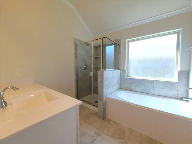 a bathroom with a bathtub and a sink