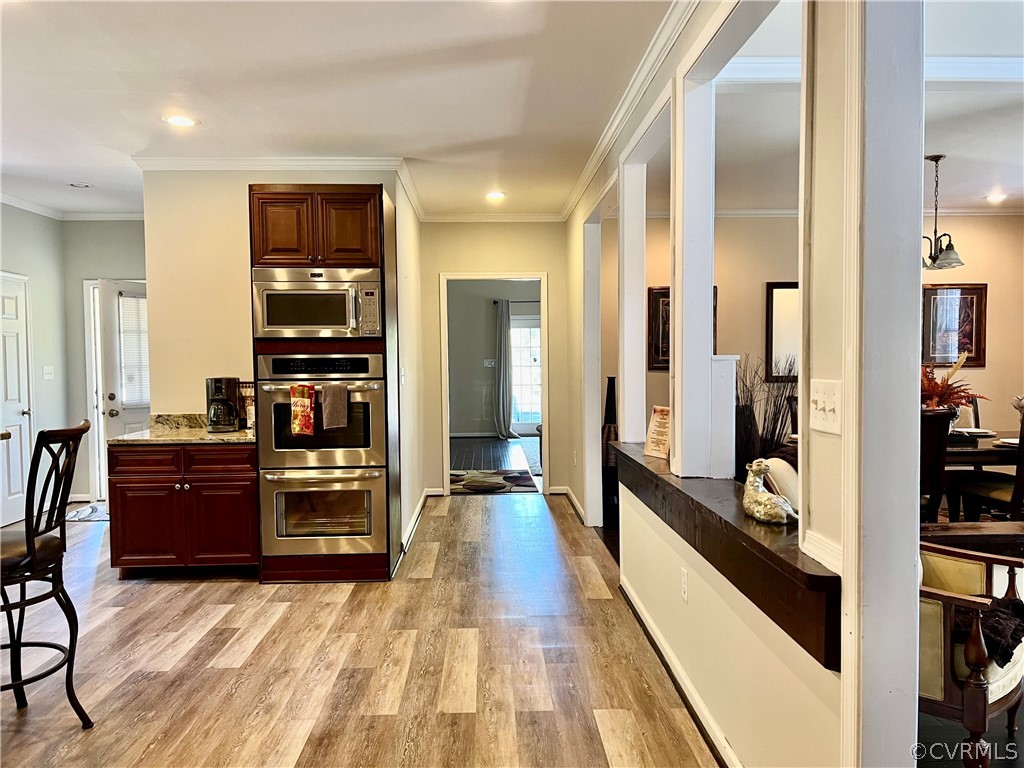 16714 Harrowgate Road Colonial Heights, VA 23834 - Photo 14 of 39 a view of a hallway and a livingroom with furniture