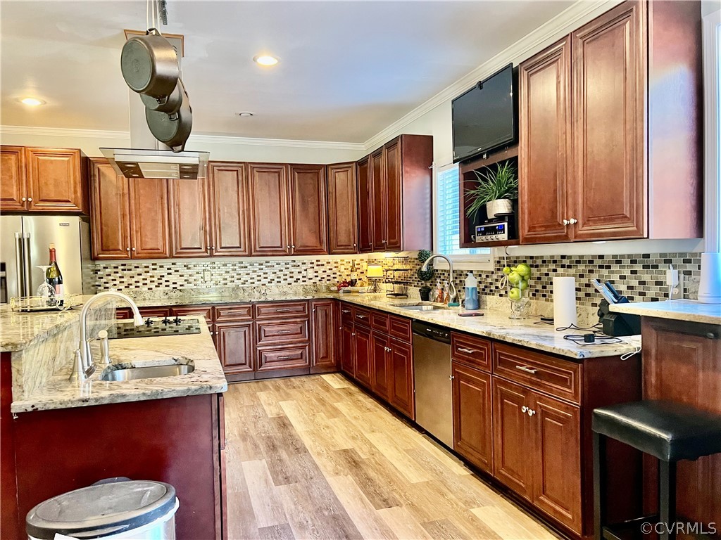 16714 Harrowgate Road Colonial Heights, VA 23834 - Photo 18 of 39 a kitchen with a sink a stove cabinets and wooden floor