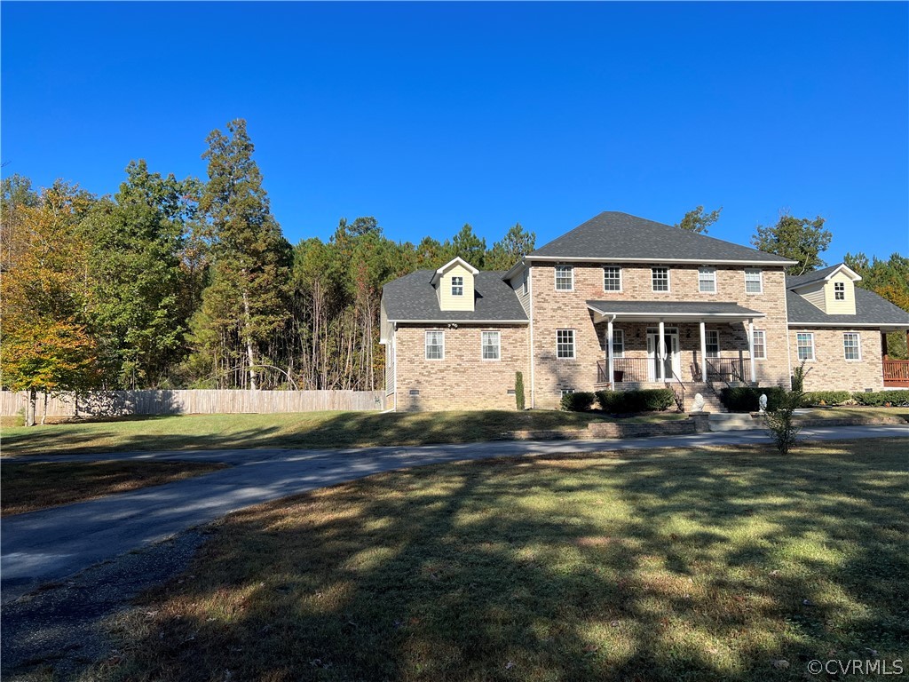 16714 Harrowgate Road Colonial Heights, VA 23834 - Photo 2 of 39 a front view of a house with a yard