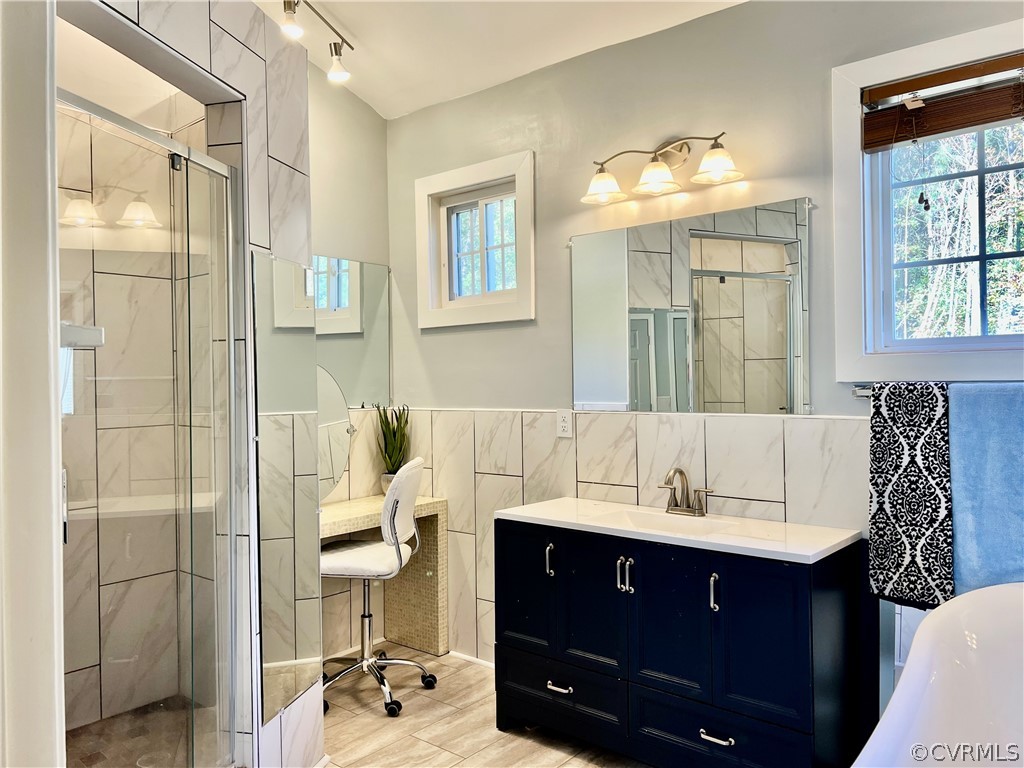16714 Harrowgate Road Colonial Heights, VA 23834 - Photo 23 of 39 a bathroom with a sink double vanity and a shower