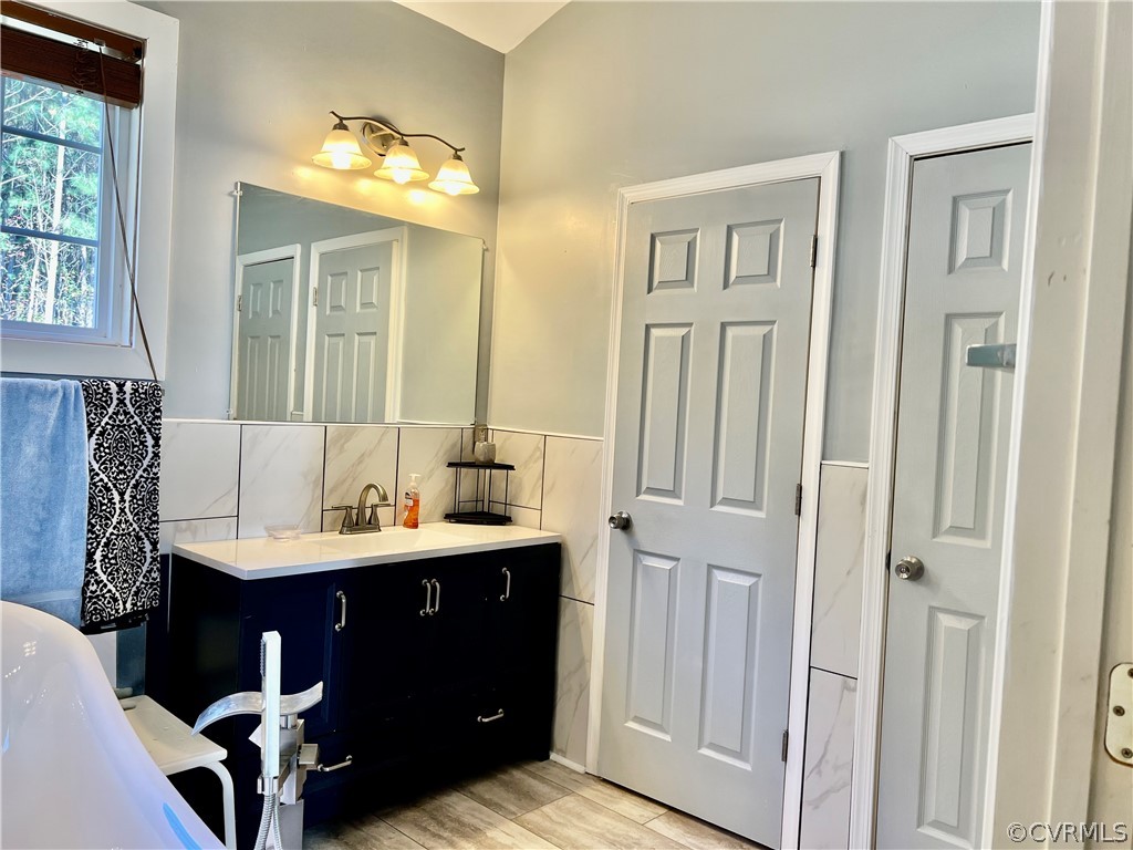 16714 Harrowgate Road Colonial Heights, VA 23834 - Photo 24 of 39 a bathroom with a sink vanity and a mirror