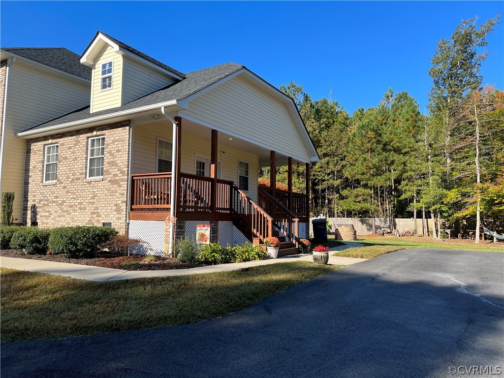 16714 Harrowgate Road Colonial Heights, VA 23834 - Photo 6 of 39 a view of a building with a yard