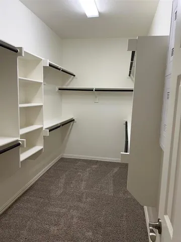 a view of an empty walk in closet