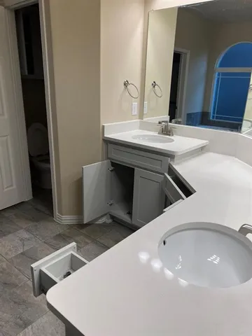 a bathroom with a sink and a mirror