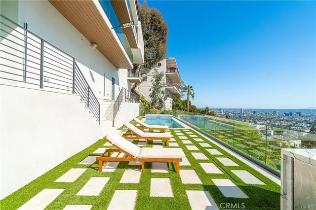 a bedroom with a large window and a bed