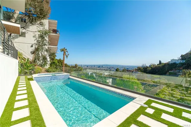 a view of entryway with stairs and wooden floor
