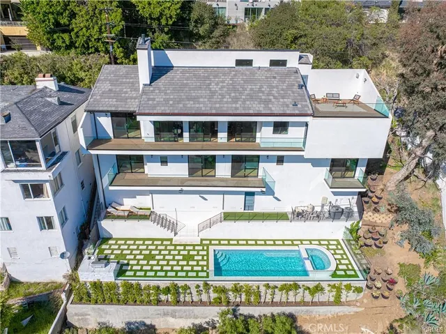 a aerial view of a house with a yard