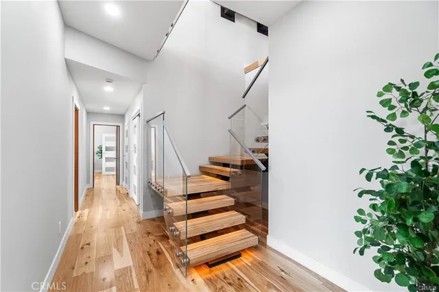 a spacious bedroom with a large bed and a rug