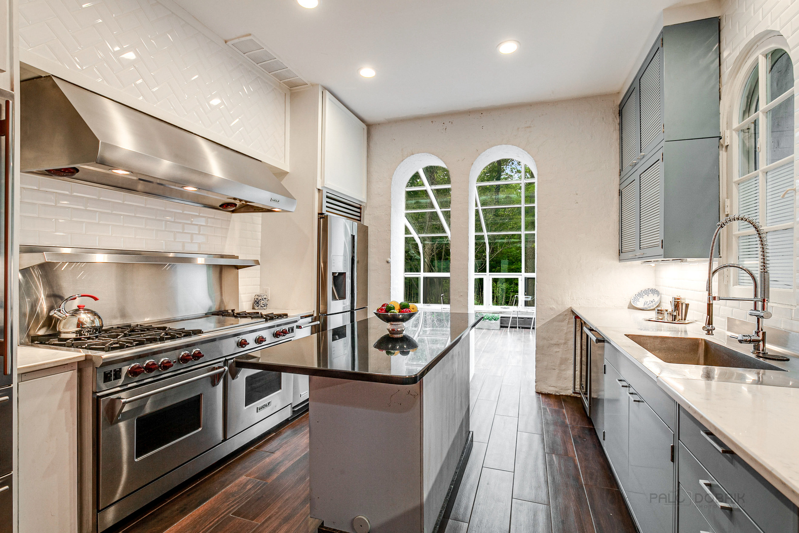 51 South Mayflower Road Lake Forest, IL 60045 - Photo 20 of 85 a kitchen with stainless steel appliances granite countertop a sink stove and cabinets
