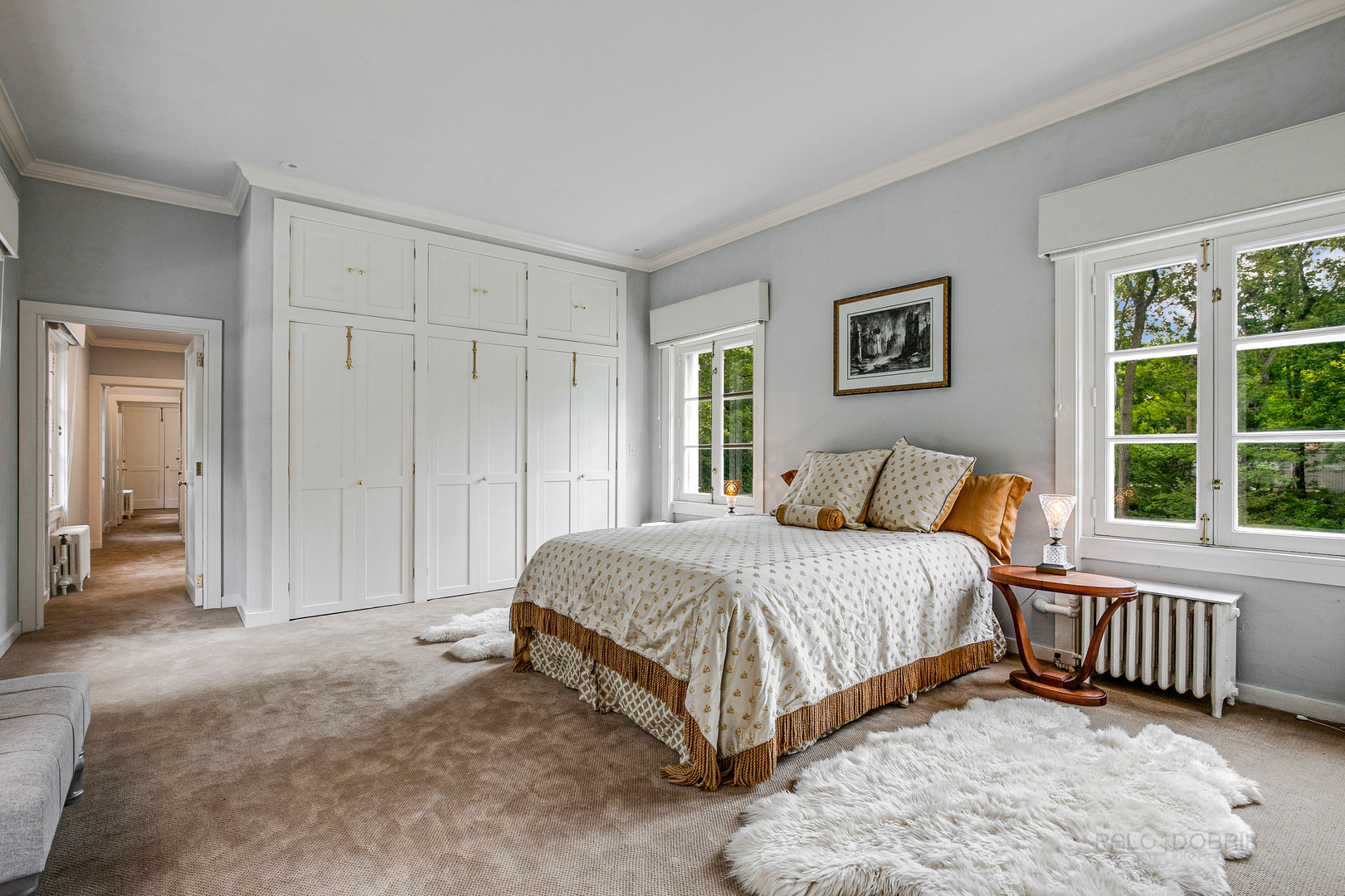 51 South Mayflower Road Lake Forest, IL 60045 - Photo 35 of 85 a spacious bedroom with a bed and a window