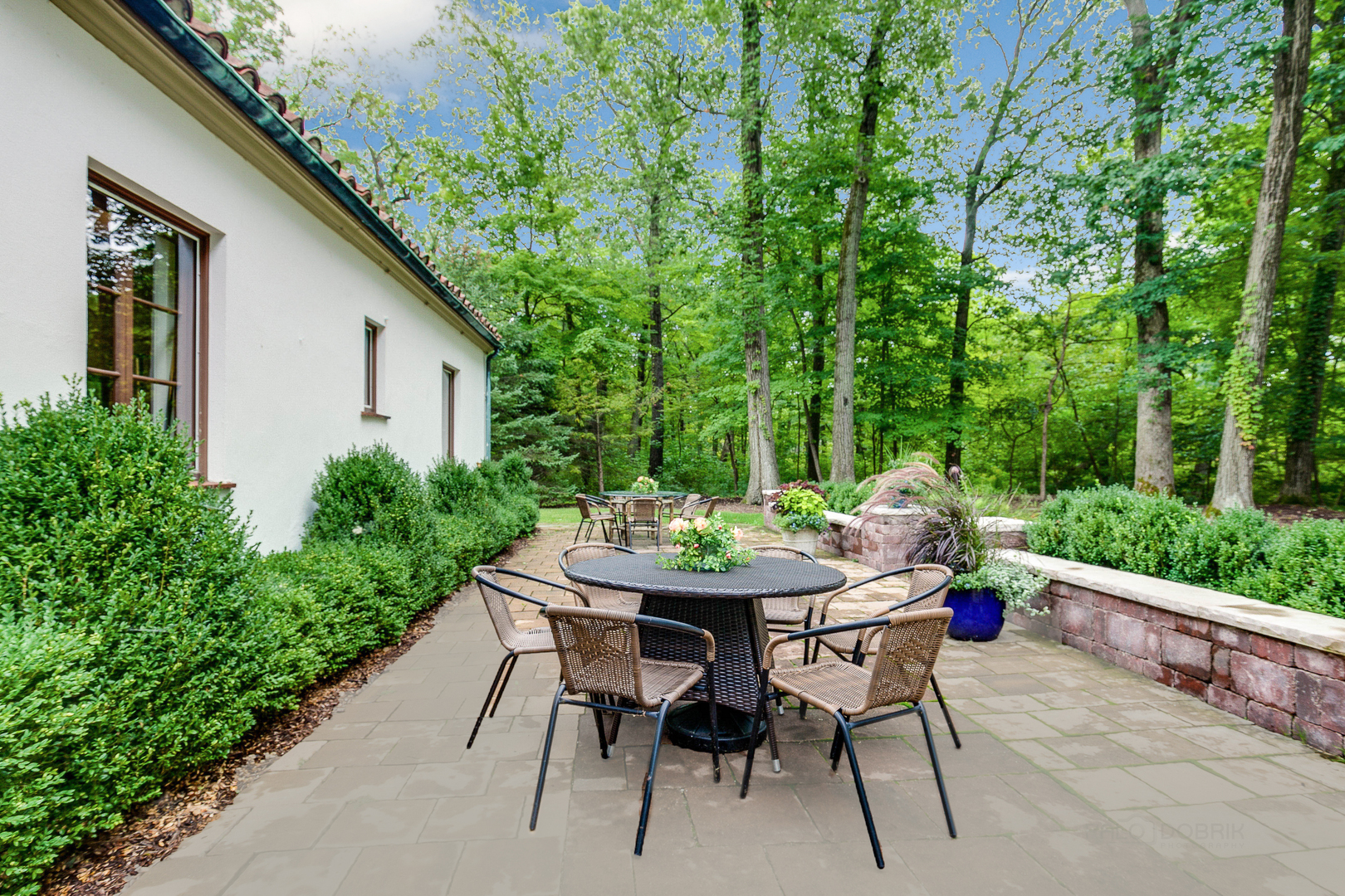 51 South Mayflower Road Lake Forest, IL 60045 - Photo 67 of 85 a view of a patio with table and chairs and potted plants