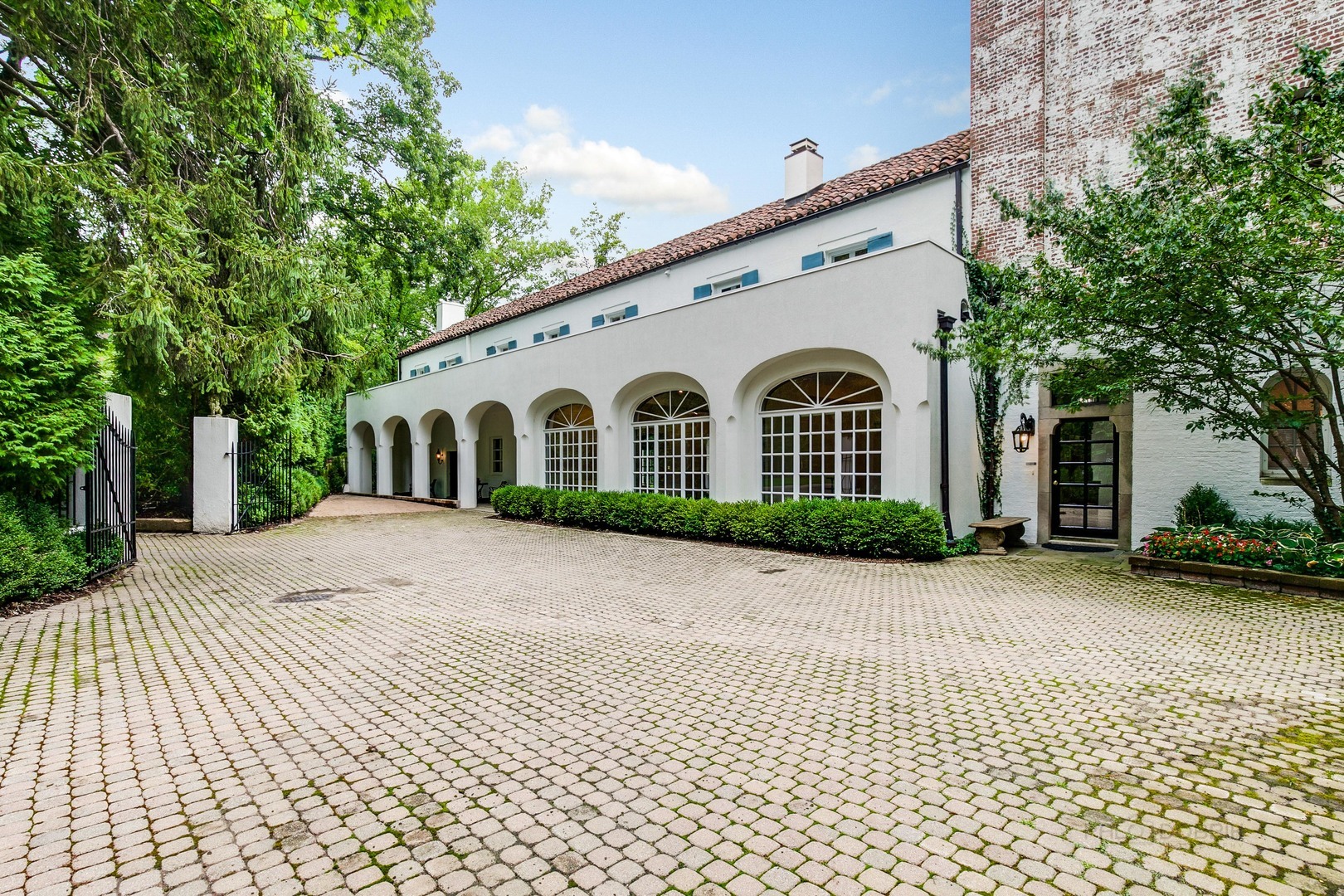 51 South Mayflower Road Lake Forest, IL 60045 - Photo 79 of 85 a view of a white house with a yard