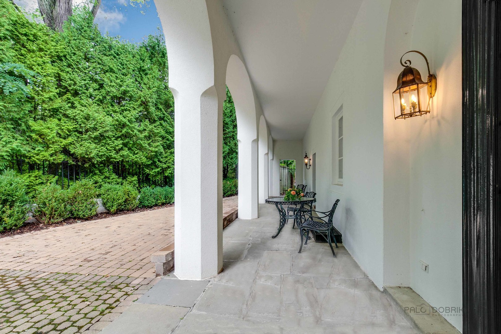 51 South Mayflower Road Lake Forest, IL 60045 - Photo 80 of 85 a view of a patio with table and chairs and potted plants