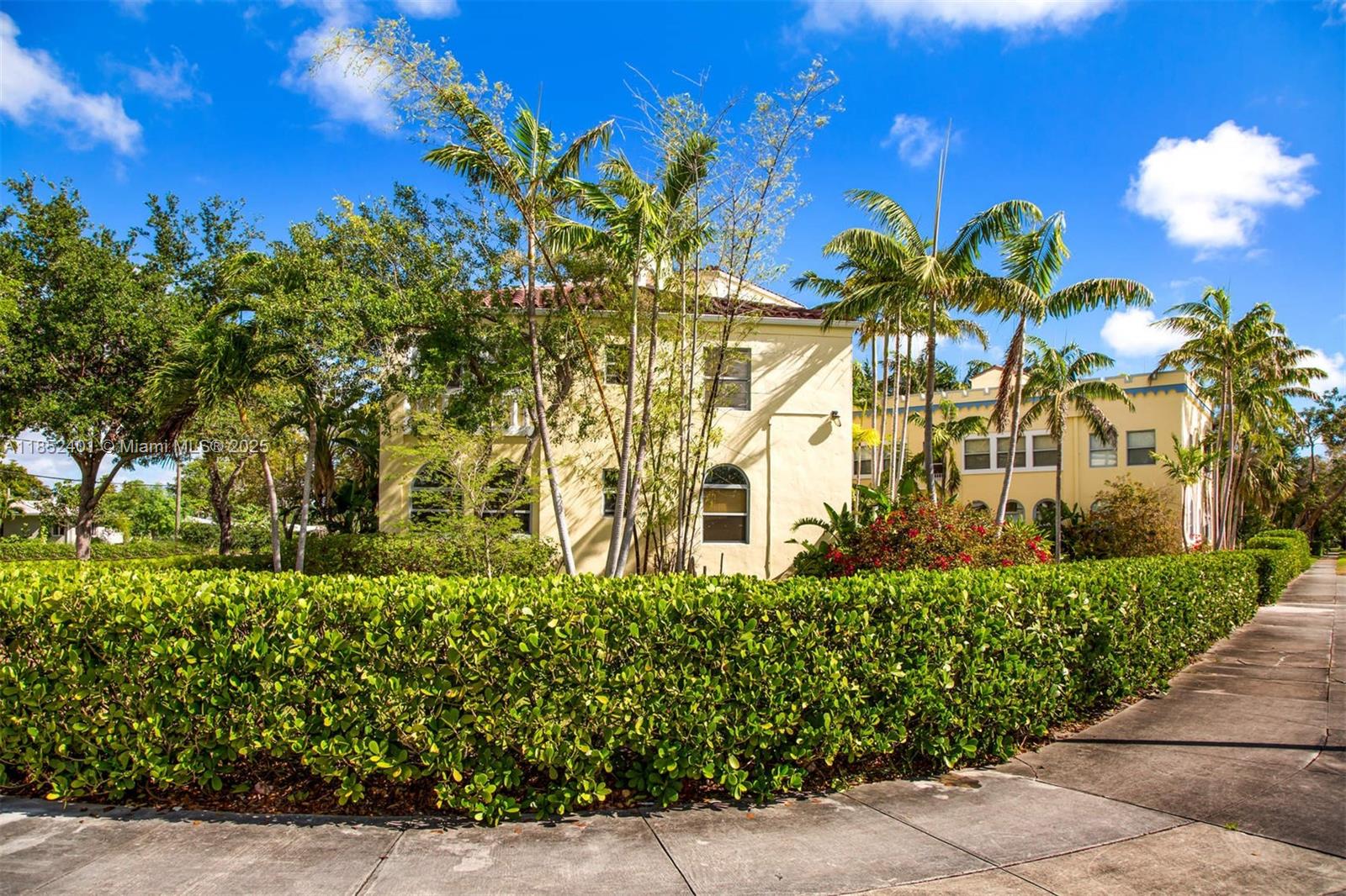 421 Grand Concourse, Unit 6 Miami Shores, FL 33138 - Photo 2 of 8 a view of a building with a lot of flower plants