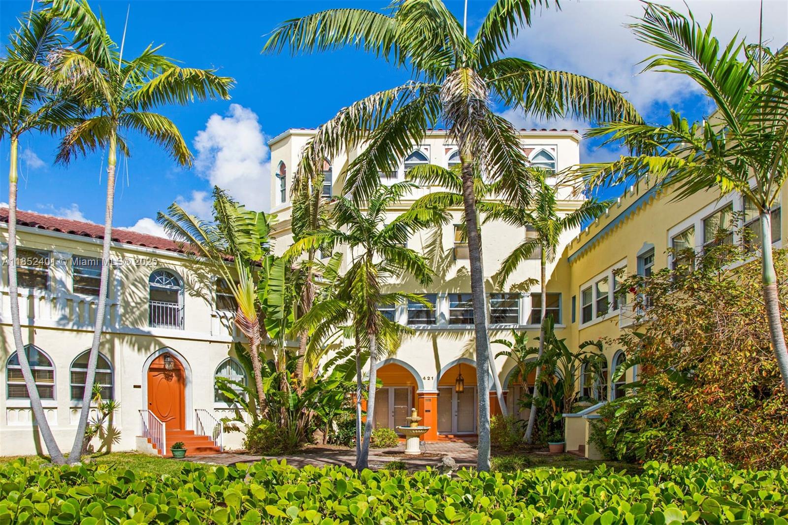 421 Grand Concourse, Unit 6 Miami Shores, FL 33138 - Photo 4 of 8 a front view of multi story residential apartment building with yard and sign board