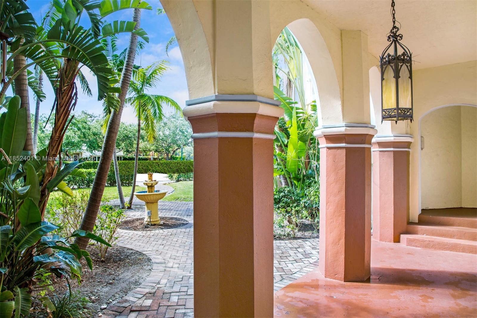 421 Grand Concourse, Unit 6 Miami Shores, FL 33138 - Photo 6 of 8 a view of porch with a yard