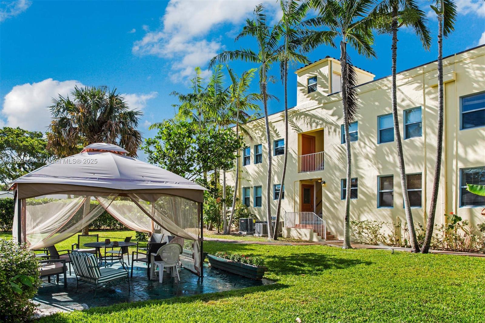 421 Grand Concourse, Unit 6 Miami Shores, FL 33138 - Photo 8 of 8 a view of an house with backyard and swimming pool