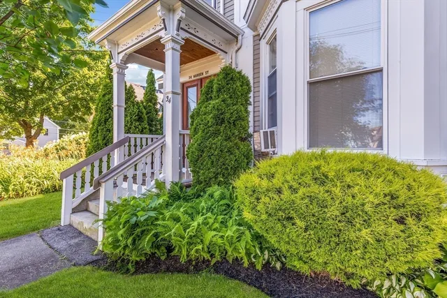a view of a garden with a deck