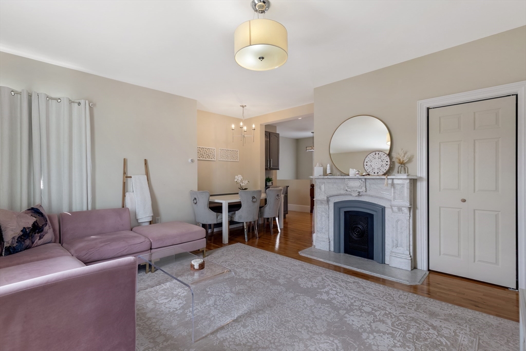 34 Warren Street, Unit 3 Stoneham, MA 02180 - Photo 12 of 34 a living room with furniture and a fireplace