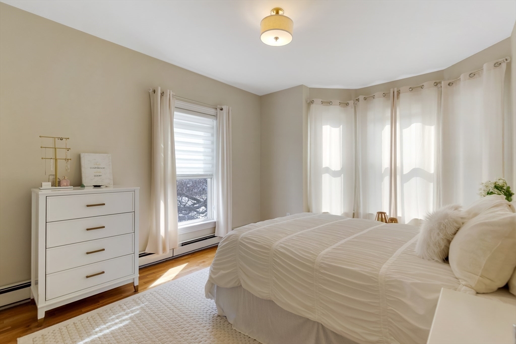 34 Warren Street, Unit 3 Stoneham, MA 02180 - Photo 14 of 34 a bedroom with a bed and a window