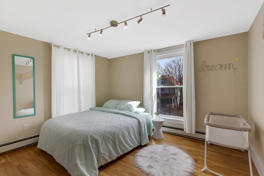 34 Warren Street, Unit 3 Stoneham, MA 02180 - Photo 16 of 34 a bedroom with a bed and a window
