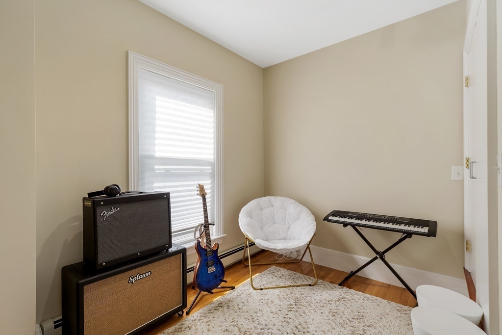34 Warren Street, Unit 3 Stoneham, MA 02180 - Photo 20 of 34 a living room with furniture and a window
