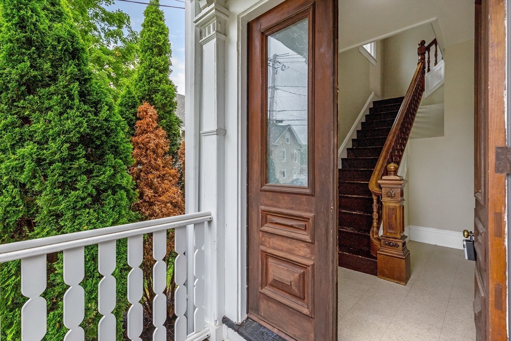 34 Warren Street, Unit 3 Stoneham, MA 02180 - Photo 2 of 34 a view of entryway with stairs and wooden floor
