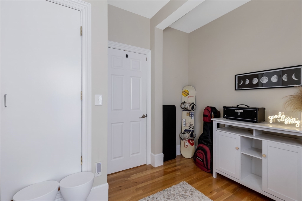 34 Warren Street, Unit 3 Stoneham, MA 02180 - Photo 21 of 34 a view of a workspace with furniture and closet