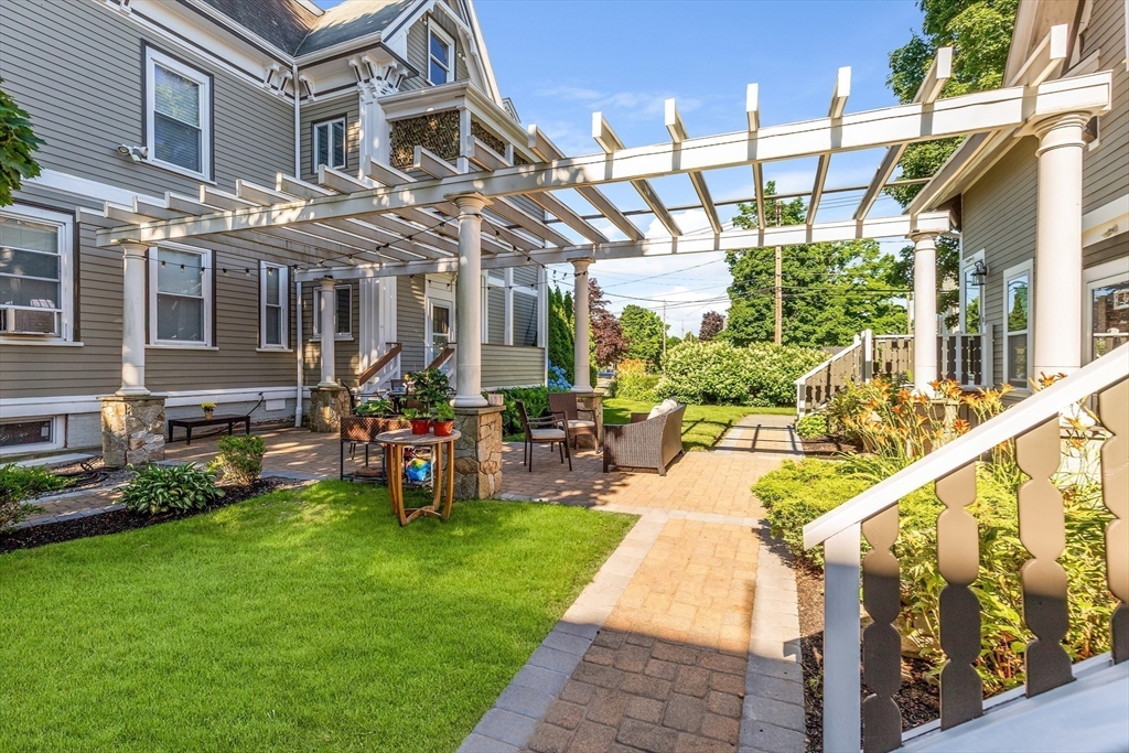 34 Warren Street, Unit 3 Stoneham, MA 02180 - Photo 28 of 34 a front view of a building with outdoor seating