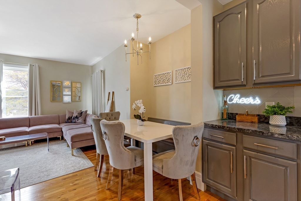 34 Warren Street, Unit 3 Stoneham, MA 02180 - Photo 10 of 34 a dining room with furniture and window