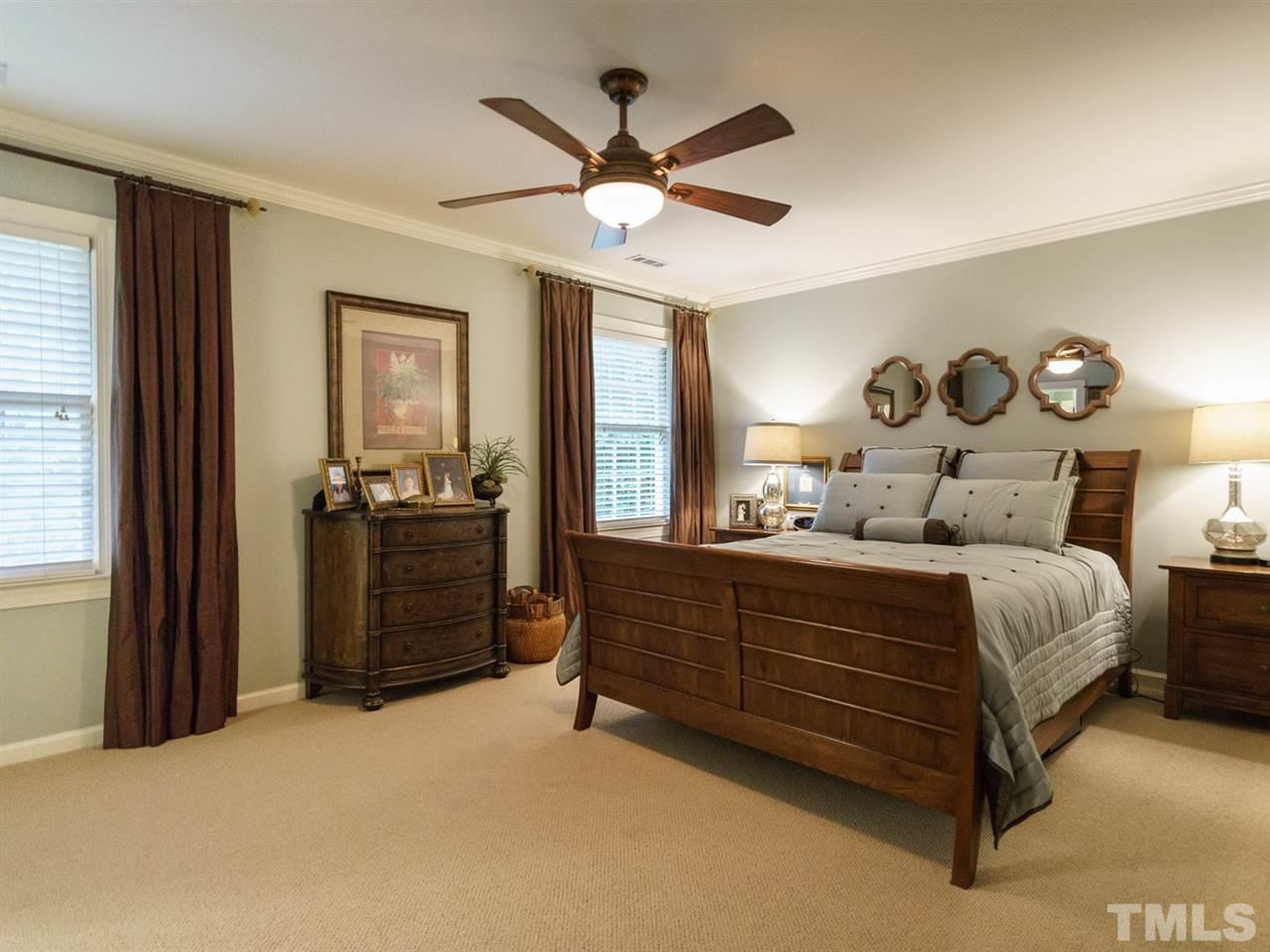 7405 Glendower Road Raleigh, NC 27613 - Photo 14 of 25 a bedroom with a bed and a window