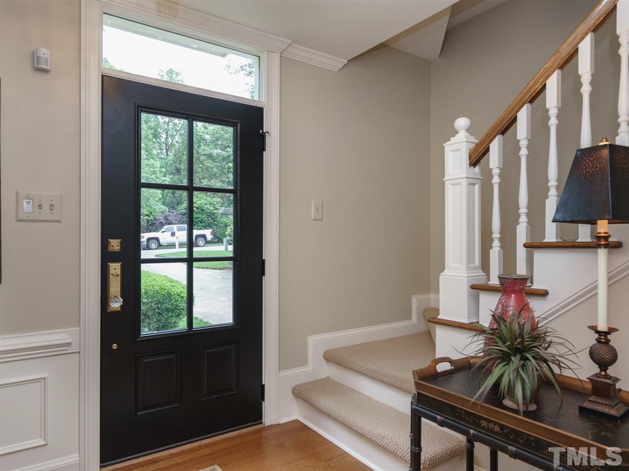 7405 Glendower Road Raleigh, NC 27613 - Photo 3 of 25 a living room with furniture and a potted plant