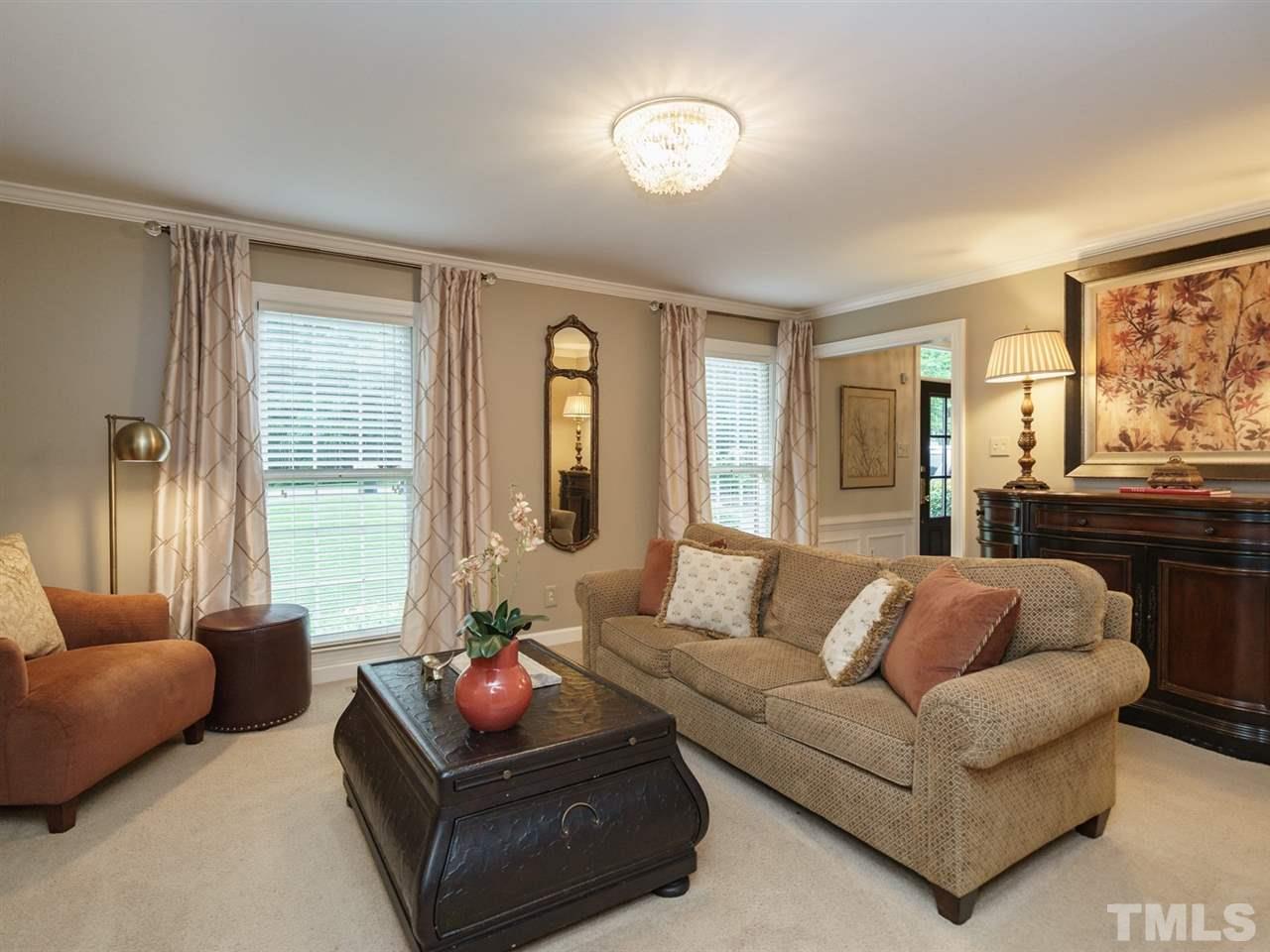 7405 Glendower Road Raleigh, NC 27613 - Photo 6 of 25 a living room with furniture and a large window