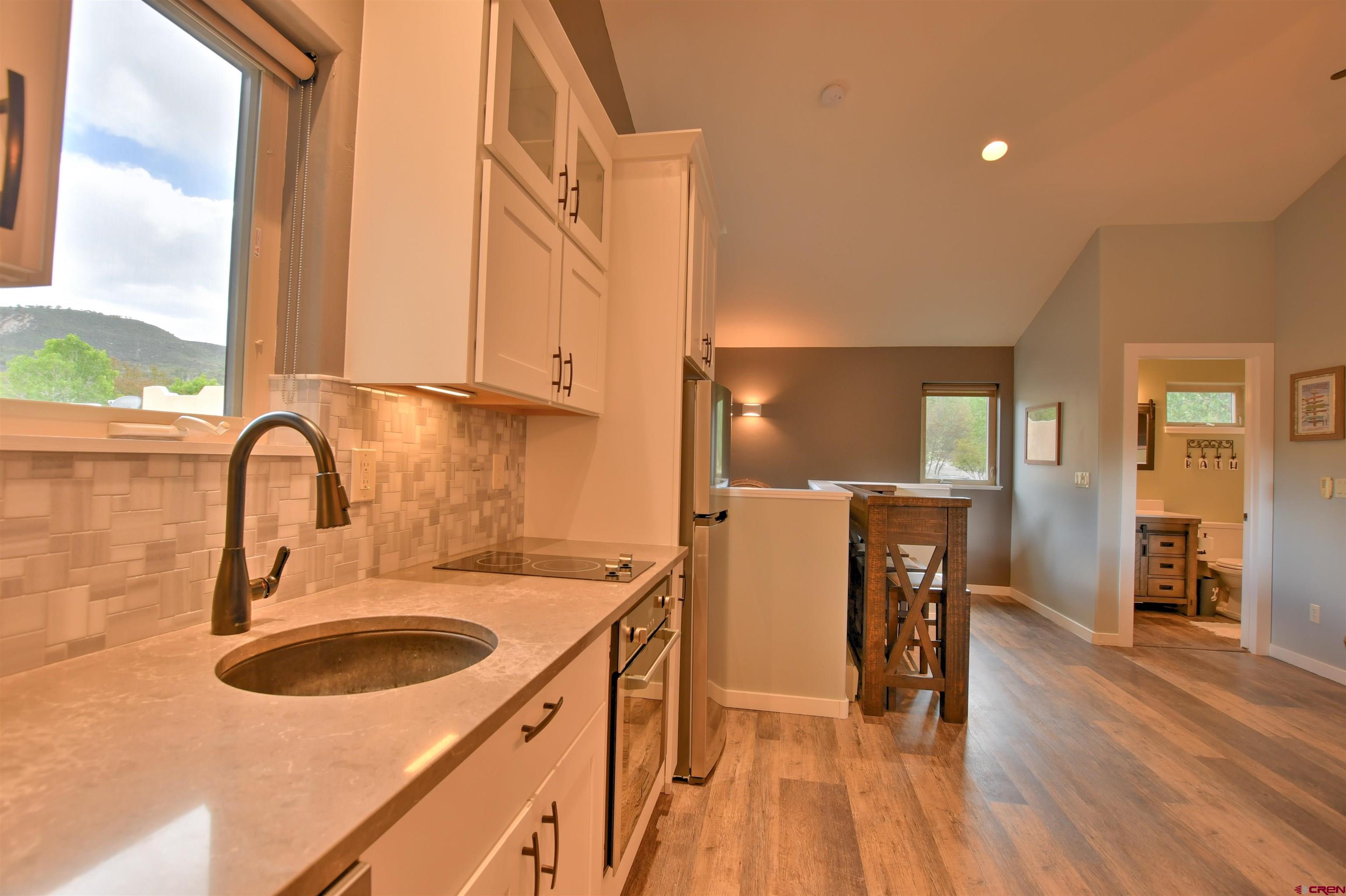 602 Chipeta Drive Ridgway, CO 81432 - Photo 18 of 41 a kitchen with a sink a counter top space and appliances