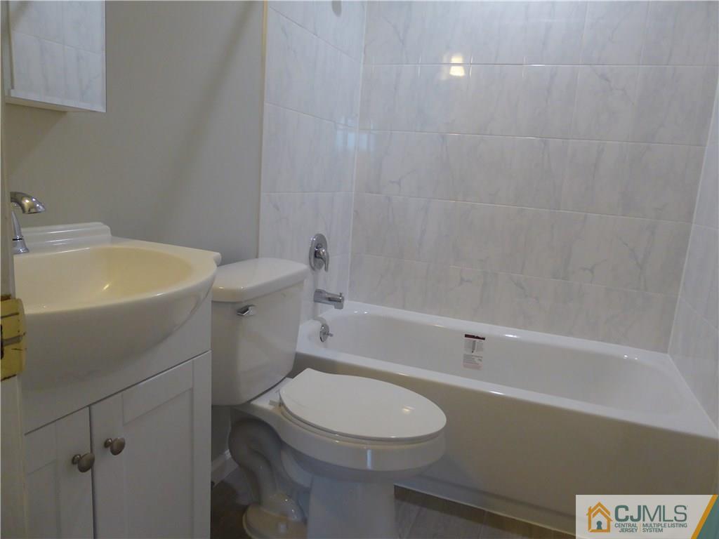 38 Stony Road West Edison, NJ 08817 - Photo 20 of 42 a bathroom with a sink a toilet and shower